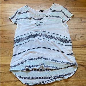 This is a women’s medium blouse.